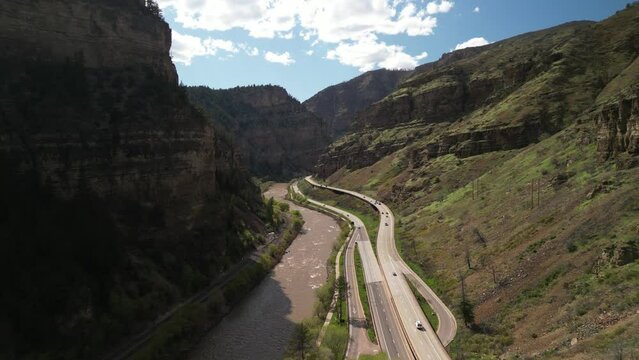 Aerial of I70 highway and Colorado River in spring through Glenwood Canyon
