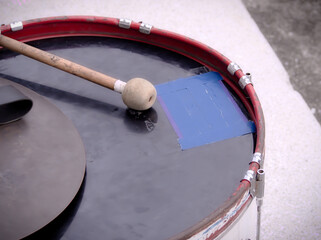 Old parade drums and drumsticks, music equipment.