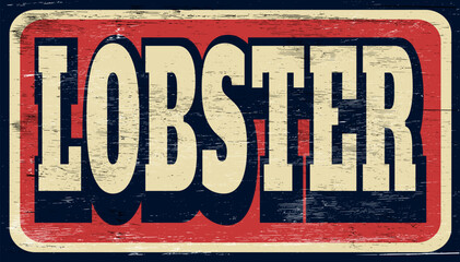 Aged and worn lobster sign on wood