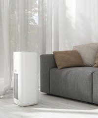 Modern air purifier in luxury living room with gray sofa on wood laminated parquet floor in...