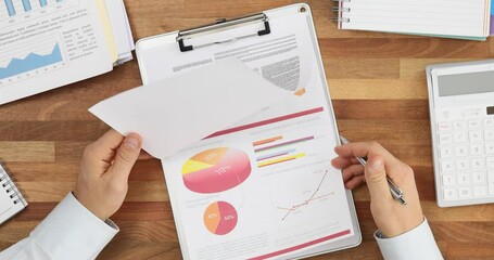 Professional signing an important legal document in office top view