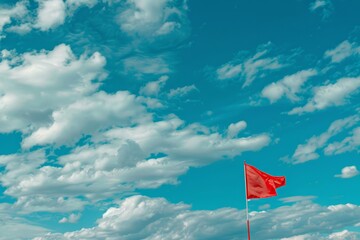 Blue sky with clouds and racing flag