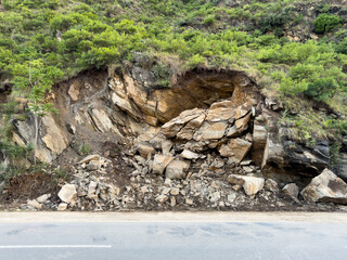 Fototapeta premium Mountain landslide large rocks blocking road in swat valley, Pakistan