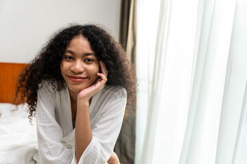 Portrait of Caucasian young girl in pajamas smile and look at camera. 