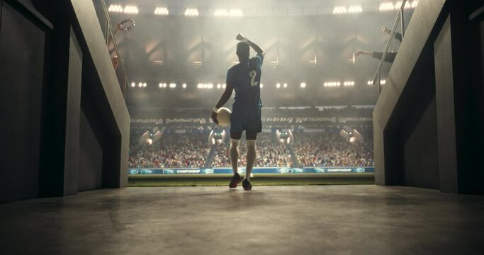 Soccer Stadium Tunnel: Athletic African Football Player Walking Out to the Field Before a Championship Match. Excited Crowd of Spectators Cheering for Their Favorite MVP Footballer. Warm Color Grading - Powered by Adobe