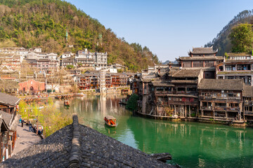 Feng Huang Ancient Town (Phoenix Ancient Town) and tourist boats on Tuo Jiang River, The famous...