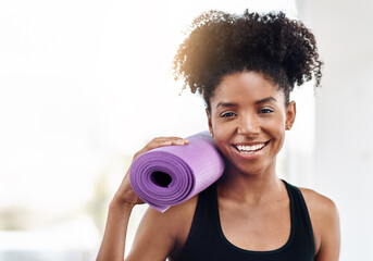 Woman, yoga mat and fitness with smile for wellness in confidence in gym for health with pilates....