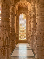 Inside pillars of om temple in jadan village pali district rajasthan. stone pillars in a hindu...