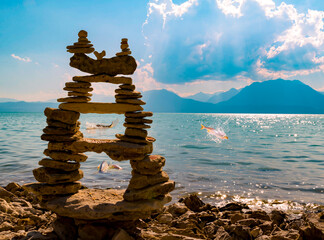 Fish frolicking in water in the texture of zen stones