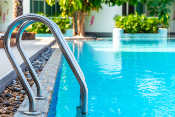 Blue outdoors swimming pool, the swimming pool stainless steel handrail, holiday vacation activity...