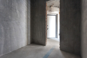 interior of the apartment without decoration in gray colors. rough finish