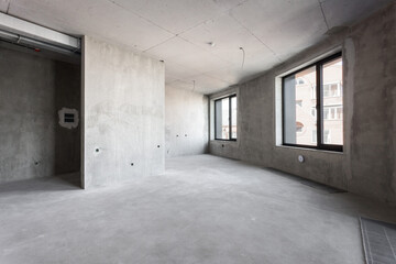 interior of the apartment without decoration in gray colors. rough finish