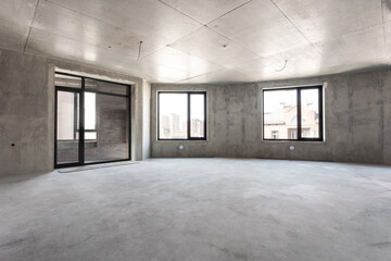 interior of the apartment without decoration in gray colors. rough finish