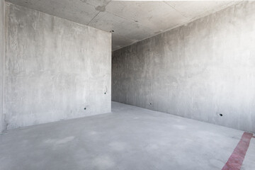 interior of the apartment without decoration in gray colors. rough finish