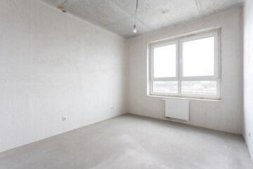 interior of the apartment without decoration in gray colors. rough finish