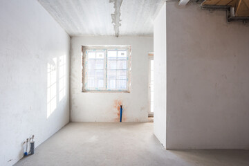 interior of the apartment without decoration in gray colors. rough finish