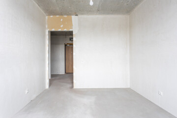 interior of the apartment without decoration in gray colors. rough finish