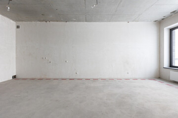 interior of the apartment without decoration in gray colors. rough finish