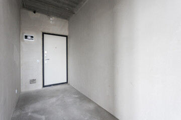 interior of the apartment without decoration in gray colors. rough finish