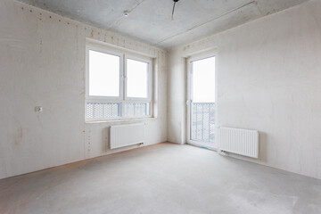 interior of the apartment without decoration in gray colors. rough finish