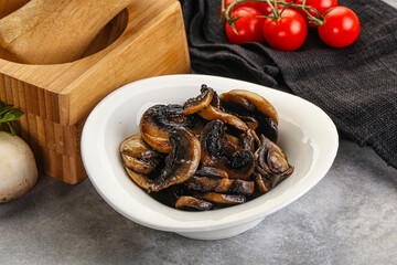 Roasted champignon mushrooms in the bowl