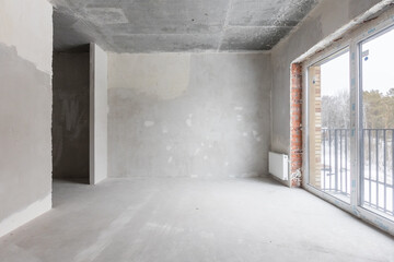 interior of the apartment without decoration in gray colors. rough finish