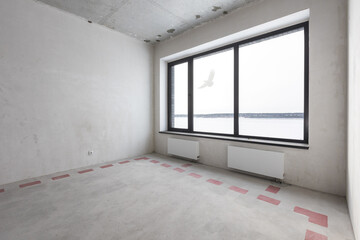 interior of the apartment without decoration in gray colors. rough finish