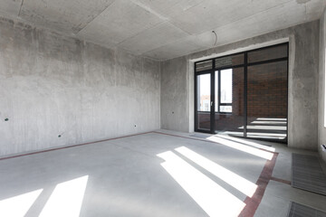 interior of the apartment without decoration in gray colors. rough finish