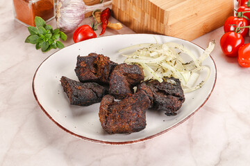 Grilled beef barbecue served onion