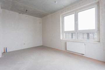 interior of the apartment without decoration in gray colors. rough finish