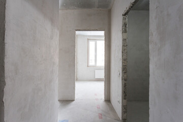 interior of the apartment without decoration in gray colors. rough finish