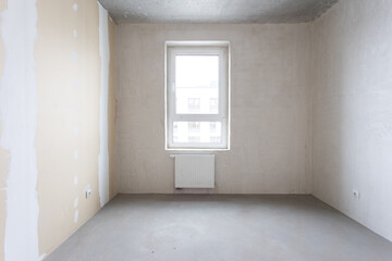 interior of the apartment without decoration in gray colors. rough finish