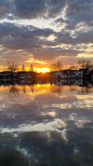 Sunset over Yarhara River Channel with Water Reflections in Madison Wisconsin