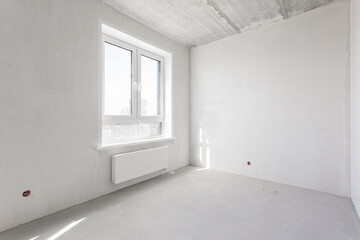 interior of the apartment without decoration in gray colors. rough finish