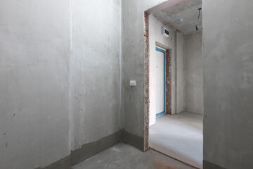 interior of the apartment without decoration in gray colors. rough finish