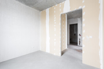 interior of the apartment without decoration in gray colors. rough finish