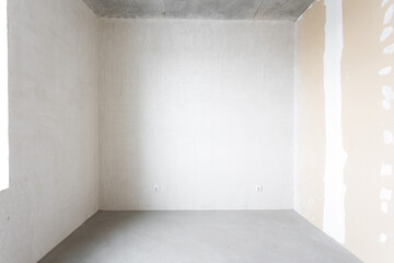 interior of the apartment without decoration in gray colors. rough finish