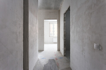 interior of the apartment without decoration in gray colors. rough finish