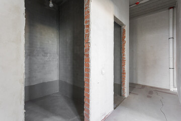 interior of the apartment without decoration in gray colors. rough finish