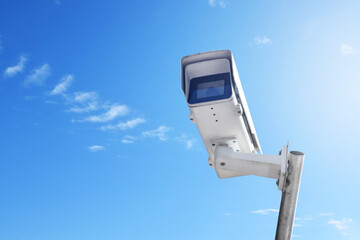 ip cctv camera installed on high metal post against bluesky to do security by monitoring technology to save human life, protect human's property and to store nature information, soft focus.