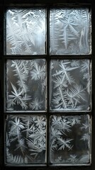 Ice crystals on a window pane form beautiful patterns