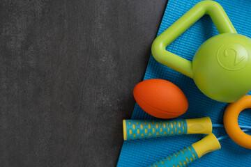 Time for exercising sport equipment on the yoga mat background, healthy and workout concept