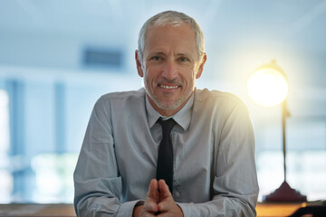 Business, mature and man in office for portrait by desk as boss with planning of company goals for growth. Smile, confident and male manager with ideas for development of mission or project at work