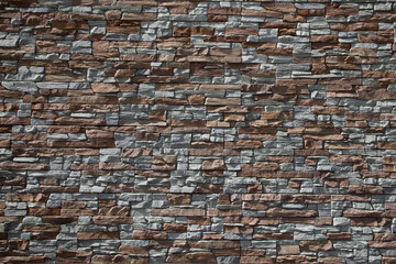 stone facade wall brown grey high background of house brick stones wallpaper