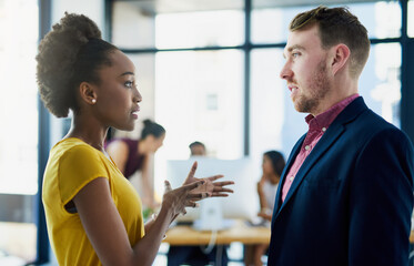 Businessman, woman and negotiation discussion in office for corporate deal or partnership, decision or disagreement. Employees, talking and B2b startup or company campaign teamwork, debate or opinion
