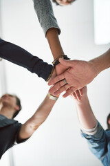 Hands, huddle and unity with design people in office from below for collaboration, support or...