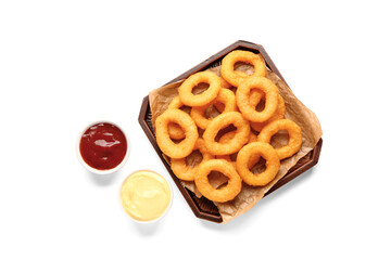 Tray with fried breaded onion rings and different sauces on white background