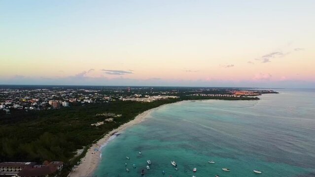 Sunset in the afternoon in the beach in Playa del Carmen, aerial view of the coast and the horizon.
