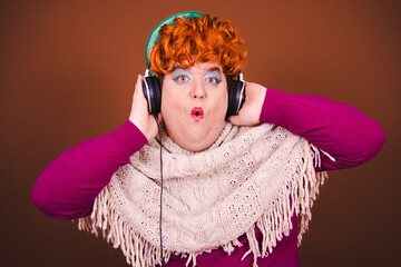 Retro style. A funny man in a Drag Queen costume listens to music.