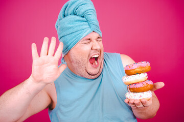 Diet. Funny fat man enjoys food after shower.